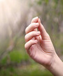 © Marina - Hand holding a small mustard seed