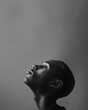 © VICHIZH - Portrait of a contemplative man with head up and looking to the side, in black and white photograph