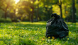 Filled Trash Bag against Blurred Clean Green Park Background with Space for Text.
