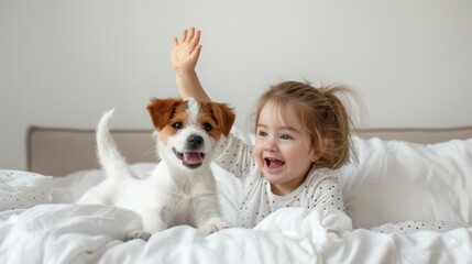 Wall Mural - A little kid and a puppy dog in bed at home