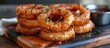 Pile of Onion Rings on Cutting Board
