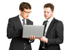 © Who is Danny - Two men in business suits reviewing a laptop together against a white background, concept of teamwork
