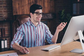 Sticker - Photo of nice young corporate man communicate video call wear striped shirt loft interior office indoors