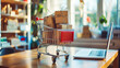 © Adrian Grosu - A cart full of boxes near a laptop computer, online shopping concept