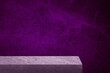 edge of grey slate stone counter with blank space for product montage display with violet, purple marble stone at background. border of stone table for decoration in modern style. front view of table.