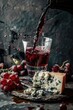 A glass of wine being poured into a glass filled with cheese and grapes. Great for food and drink concepts