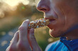 © Emanuel - A man, before a morning run, consumes a cricket cereal bar, seeking a boost of sustainable energy