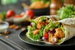Tortilla wrap with chicken and fresh vegetables in plate on wooden table