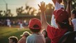 © Buzz Media - Parents and kids watching youth sports game, in the crowd at stadium cheering family playing baseball soccer field sport
