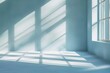 © Elmira - Room with numerous windows, casting shadows on light blue walls. Minimalist design with natural light streaming in