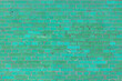 Texture of an old green brick wall. Abstract construction background.