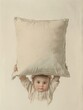  A young boy concealed beneath two pillows stacked above and below his head