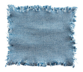 piece of torn denim on a white background. denim texture