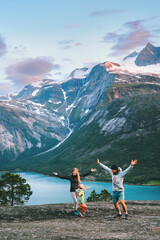 Wall Mural - family travel lifestyle - parents playing with child outdoor in norway - mother, father and kid daug