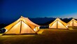 glamping at night few glowing tents