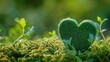 A green felt heart stands out against the backdrop of vibrant green