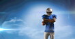 Image of excited american football player holding ball on cloudy blue sky with pulsing light