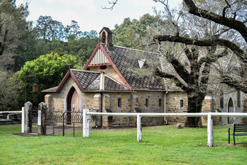 Poster - old stone church in a green field