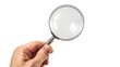 © Hammam - hand hold magnifying glass, isolated white background