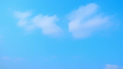Wall Mural - 4K UHD sky time-lapse captures the horizon's beauty, with layers of cirrus and clouds moving gracefully in a bright summer sky, offering a glimpse into the dynamic tapestry of the heavens.
