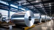 Photo of large rolls of aluminum at a processing plant, focusing on the scale and storage of metal materials,