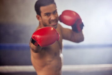 Canvas Print - Man, punch and boxer with gloves in ring for training, workout and practice for fighting competition. Boxing, pro champion and serious with sport for self defense, topless and healthy body in gym