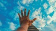 © Paul - Man's hand reaching out towards a staircase set against a vibrant blue sky, emphasizing growth and success in a career journey