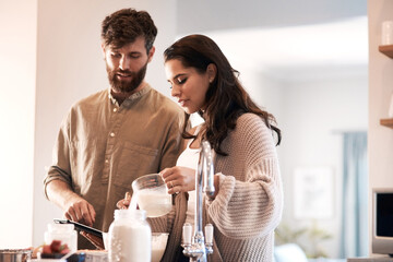 Sticker - Couple, kitchen and tablet for cooking, online recipe or internet for cake or breakfast at home. Man, woman and talk with tech for ingredient instruction for bake and fun in relationship on holiday