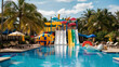 Swimming pool with slides at summer resort. Aqua park with colorful amusement equipment, inflatable ball and rings, tropical

