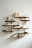 Fototapeta  - A series of modern wall-mounted shelves with clean lines and minimalist design, arranged in a staggered formation on a plain wall, offering stylish storage solutions for books, decor, and more. 