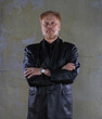 © serikbaib - portrait of an old red-haired man in a black jacket