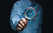 © Ei - Service guarantee, Validation concept for business process automation, quality assurance management, certification, digital transformation. Businessman show checked icon on hand. Quality control..