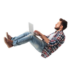 full body young man laying in the air floating while using laptop isolate on transparency background PNG