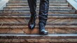 © volga - Businessman ascending office staircase in modern building