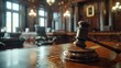A judge's gavel rests atop a courtroom table, symbolizing authority, order, and the impartial dispensation of justice