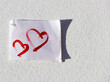 Two hearts on a piece of paper with a red felt-tip pen