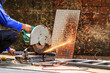 worker using electric fiber circle cutting machine cutting the steel bars