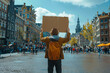A protester holding a sign aloft in a crowded city square, demanding action on climate change and environmental justice. Concept of climate activism. Generative Ai.