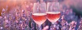 Fototapeta Paryż - glasses with pink wine on lavender background