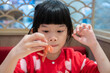 Cute little asian child girl eating food