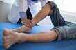 Doctors are examining patient muscle injuries and doing physical therapy for patient to move muscles so they can be used regularly because physical therapy will help strengthen muscles and blood flow.