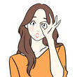 © maru - 驚いた表情で手の隙間からのぞき込む女性