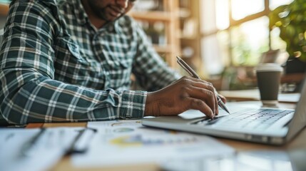 Wall Mural - Close up of person with a disability working happily at desk.