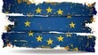   A grungy European Union flag with yellow stars along the edges