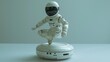 A modern miniature robot that is an electronic device. Small, white, elegant, mini robot equipment for the home.