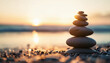© Anna - A serene stack of balanced stones on a calm beach, symbolizing peace and mindfulness.