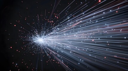 fire work of white and blue lines exploding upwards against a black background