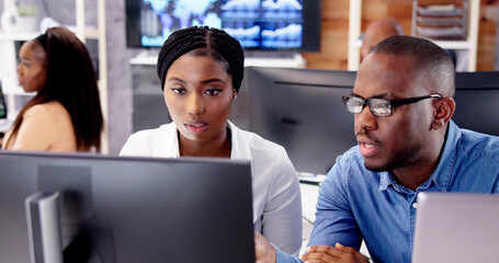 Poster - African Financial Data Analysts Using Dashboard On Screens