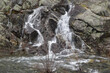  water  flowing over the rocks of the  spillway