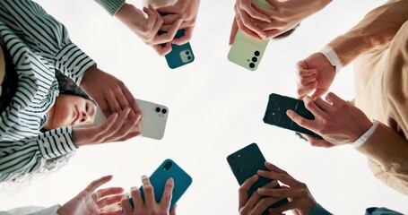 Canvas Print - Business people, hands and networking with phone below for communication, data share or sync on a white background. Low angle or closeup of young employees on mobile smartphone, social media or app